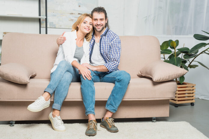 Couple style a sofa in simple and elegant manner