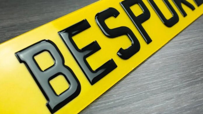 A yellow & black personalised license plate